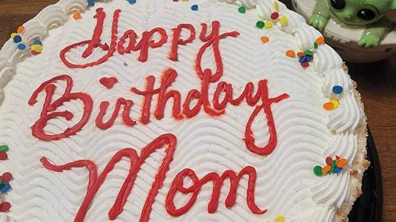 white Costco birthday cake that says Happy Birthday Mom