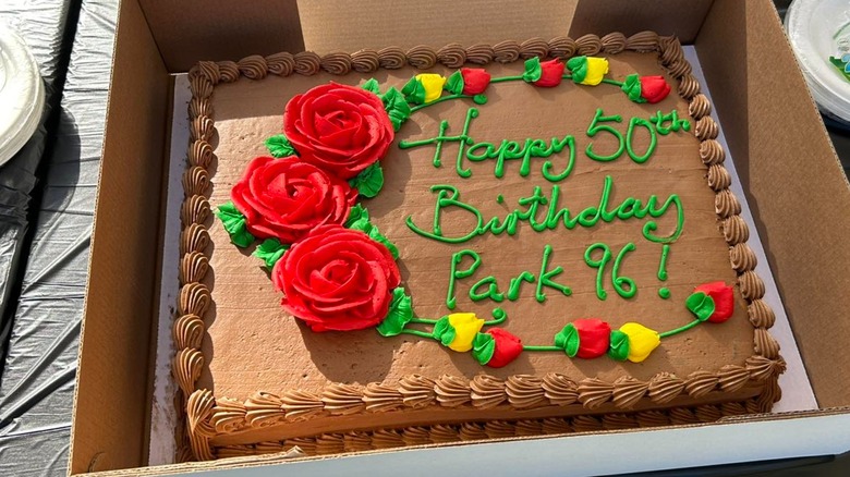 Costco chocolate birthday cake with green icing and red roses