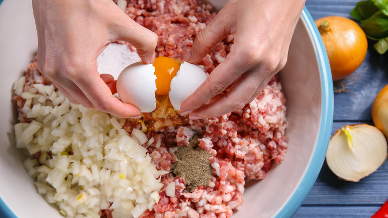 Person making meatloaf mix