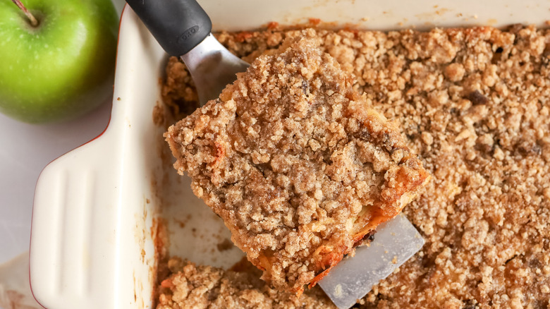 Apple matzo kugel being sliced and served