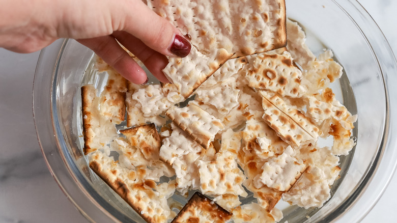 Matzo pieces soaking in water