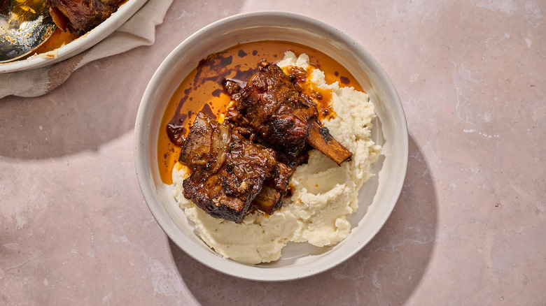 beer braised short ribs in a bowl with potatoes