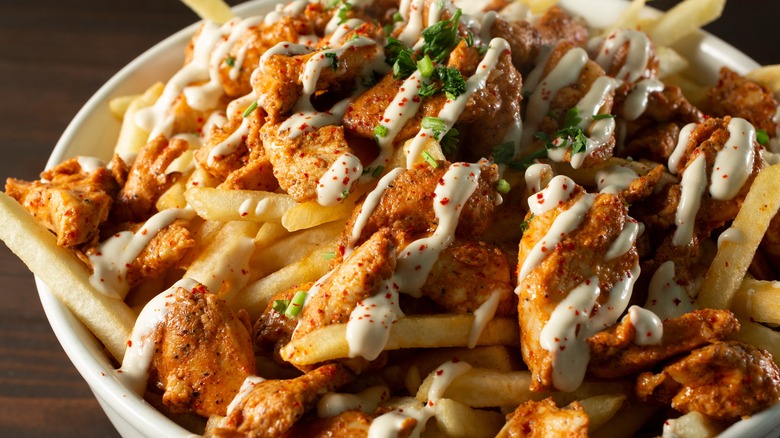 bowl with chicken fries and sauce