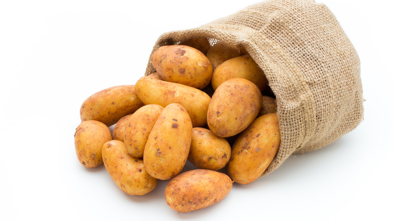 russet potatoes in burlap sack