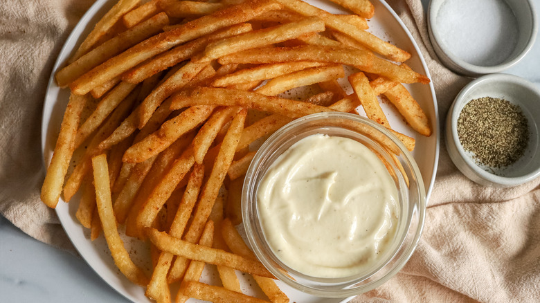 fries with truffle aioli on a plate