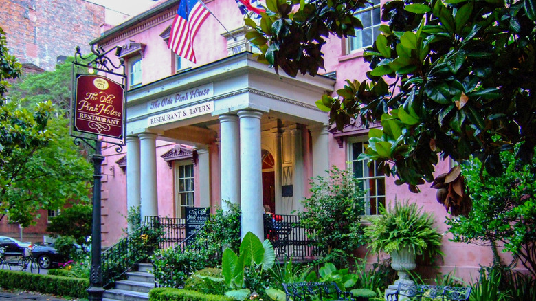 Exterior of the The Old Pink House restaurant Savannah with old American flag