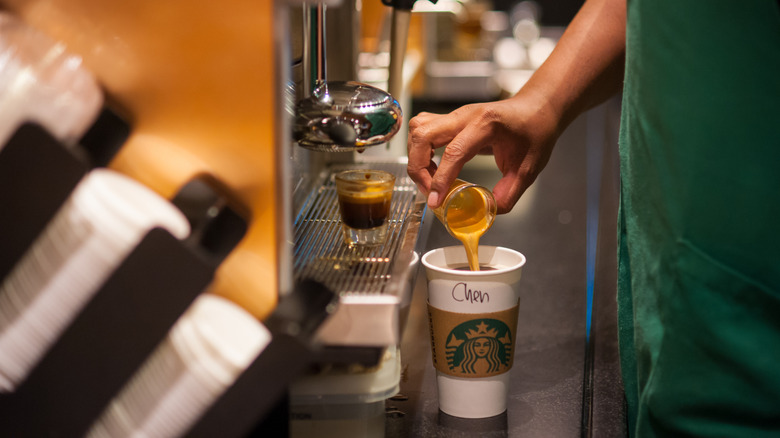 barista making a drink at Starbucks