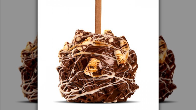 s'mores candy apples covered in chocolate, graham cracker, and marshmallow