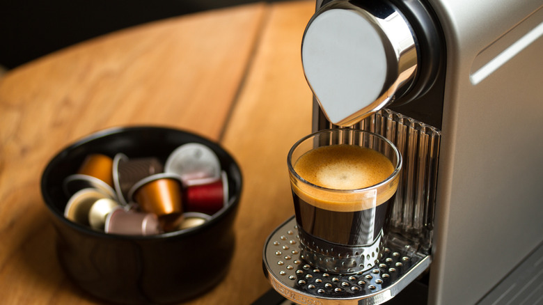 Nespresso coffee machine brewing a cup