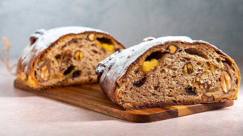 halved sourdough bread with fruit and nuts