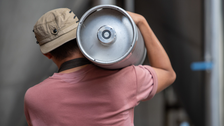 Person carrying a keg