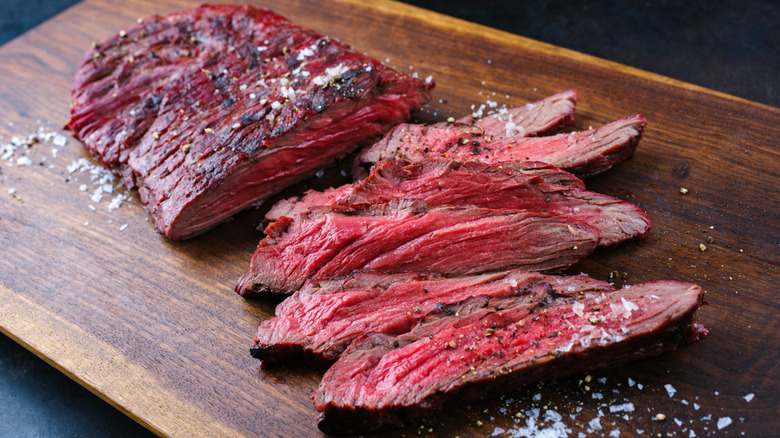 sliced flap steak on a cutting board