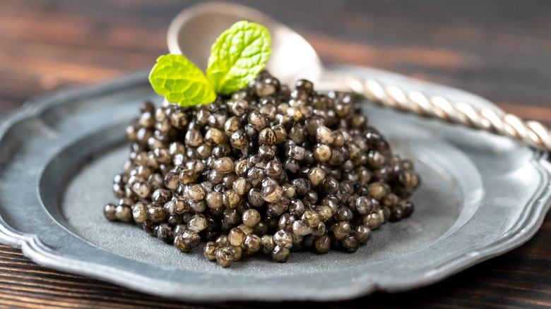 pile of caviar on a silver plate