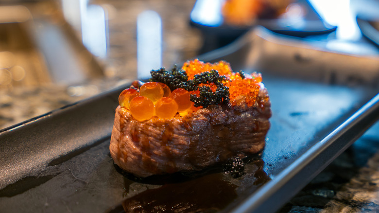 steak topped with caviar