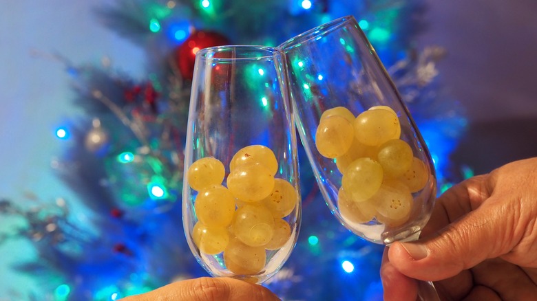 12 grapes in champagne glasses