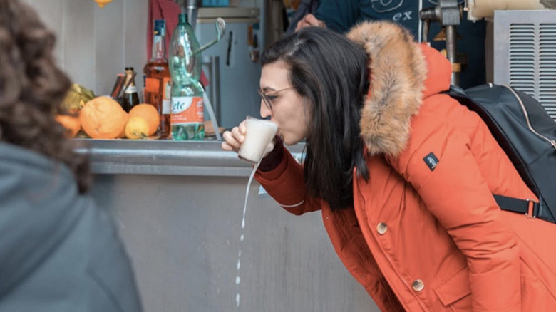 women drinking foamy lemonade