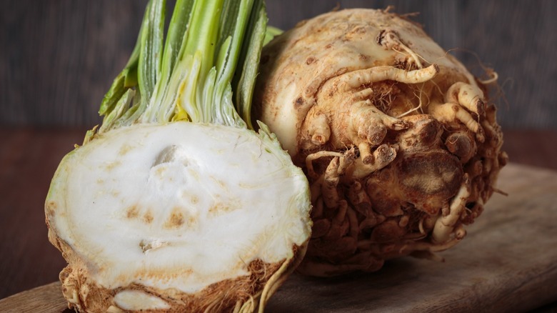 Fresh whole and sliced celeriac