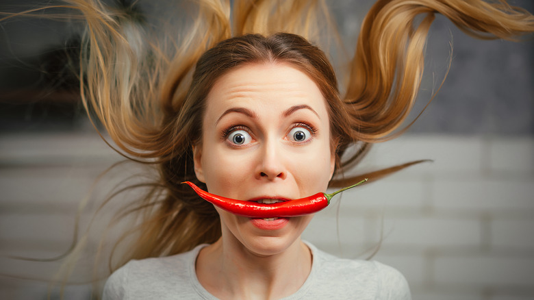 Woman eating spicy food