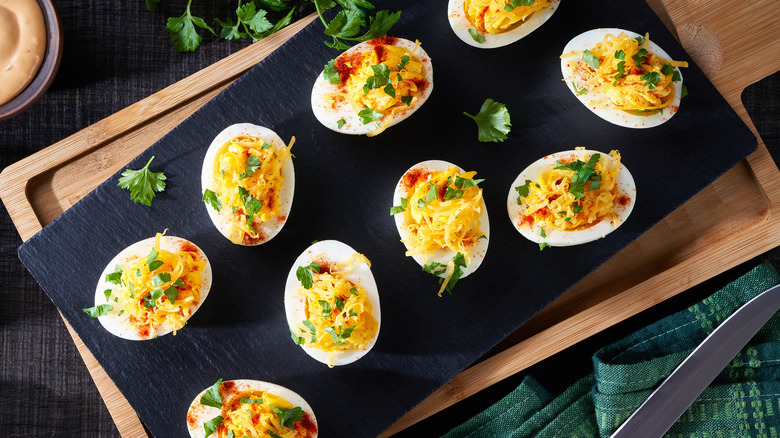 tray of deviled eggs with cheese