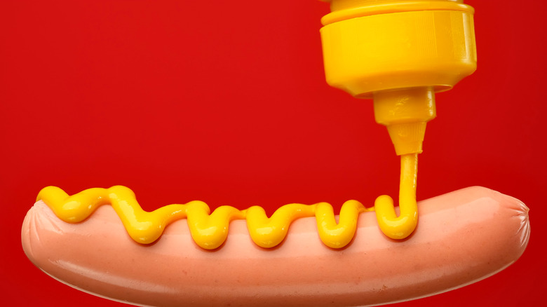 yellow mustard on hot dog