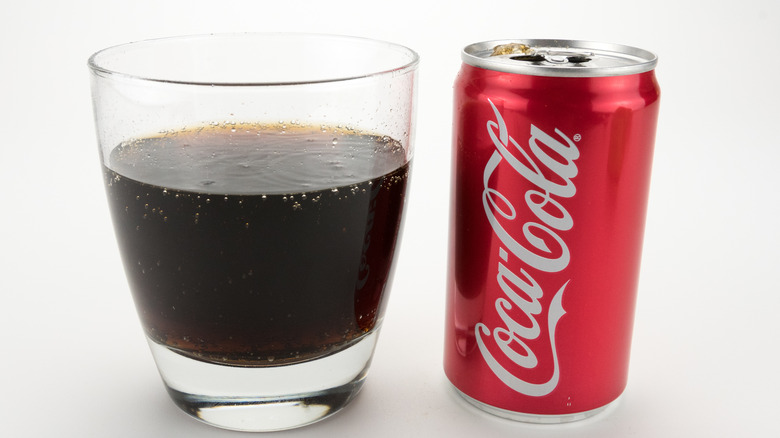 can of Coke and glass