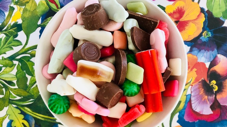 Overview of a bowl of assorted Swedish candies on a floral background