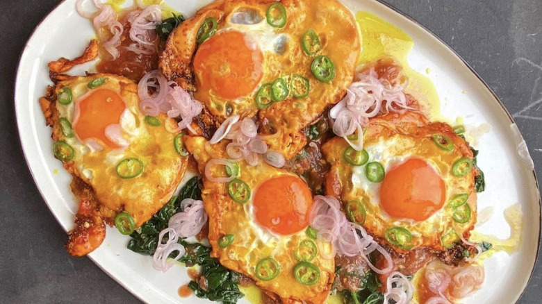 Turmeric fried eggs with tamarind dressing