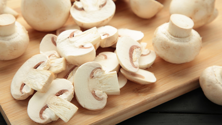 sliced mushrooms on a cutting board