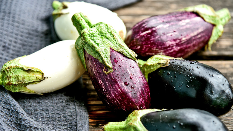 white, striped, and purple baby eggplants