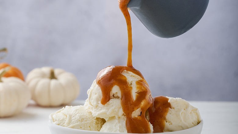 pumpkin syrup drizzled over ice cream