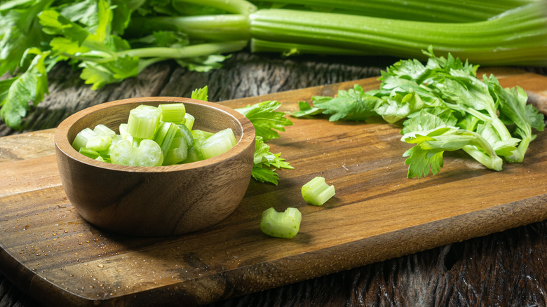 celery on wooden cutting board