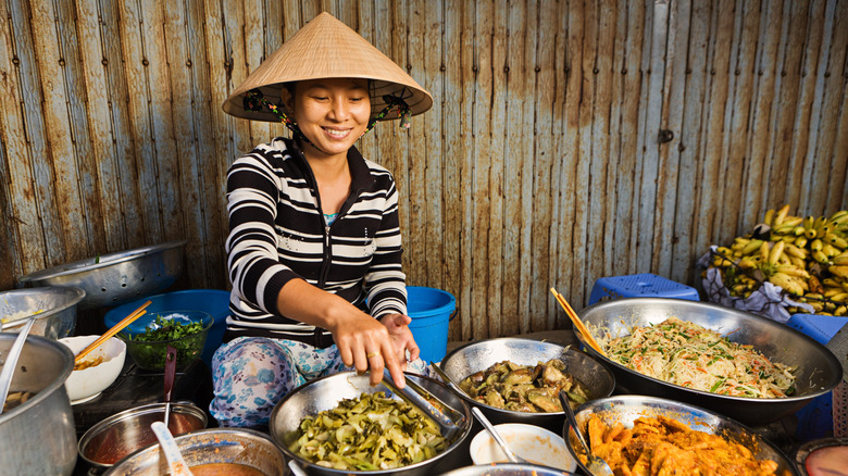 vietnamese woman serving food