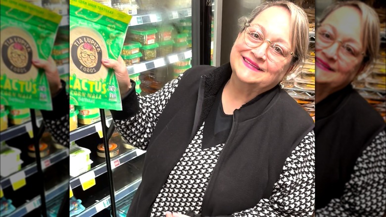 Tia Lupita's namesake holding tortillas