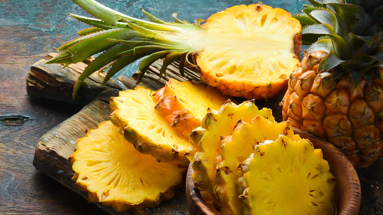 Pineapple slices on cutting board