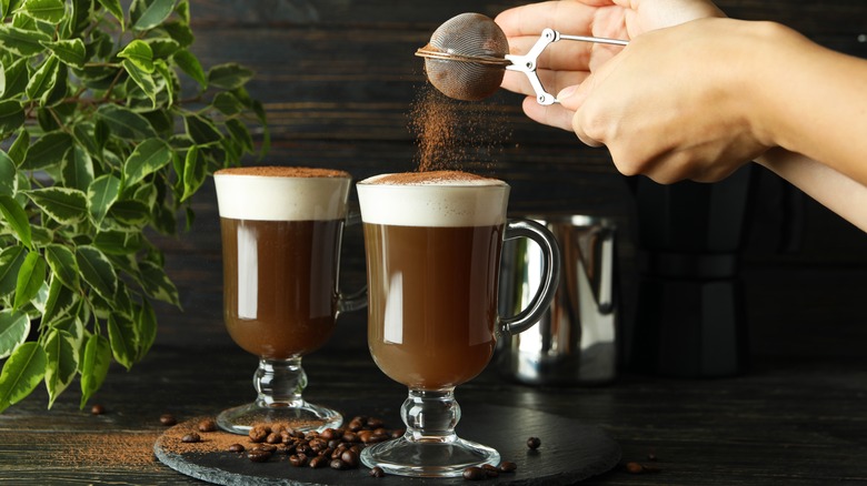 Shaking cocoa on Irish coffee