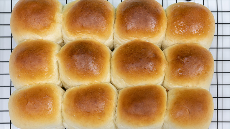 Bread rolls on a cooling rack