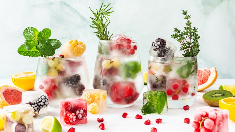 Frozen berry ice cubes in drinks