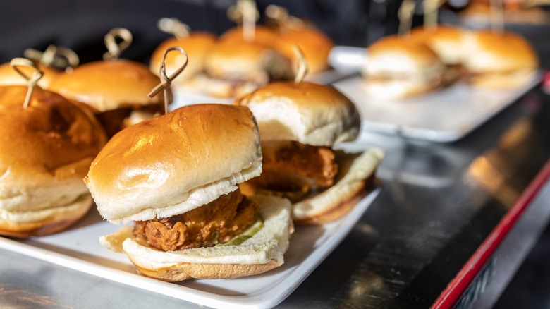 Several fried chicken sliders