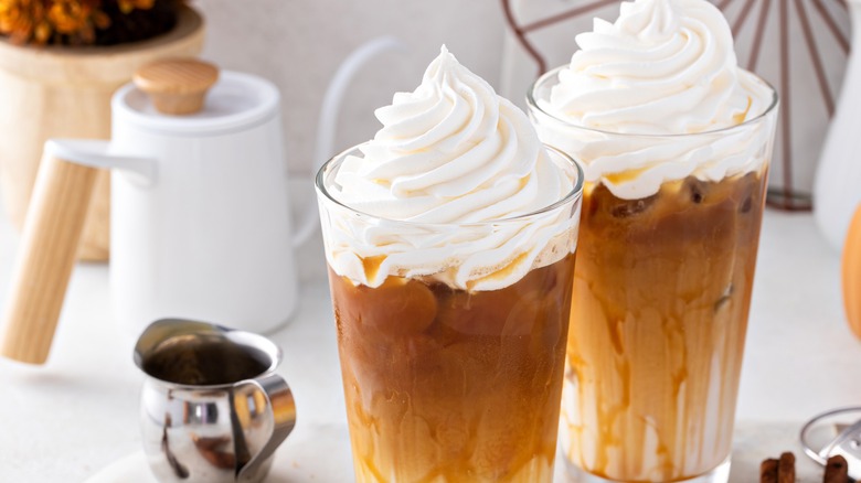 pumpkin spiced iced lattes with whipped cream