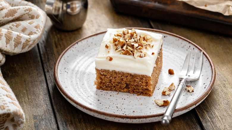 pupmkin cake on a white plate with white icing