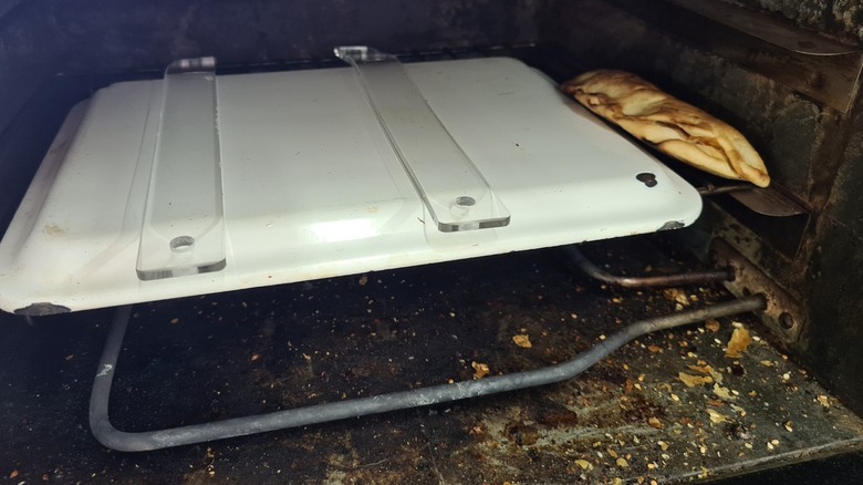 A dirty toaster oven interior