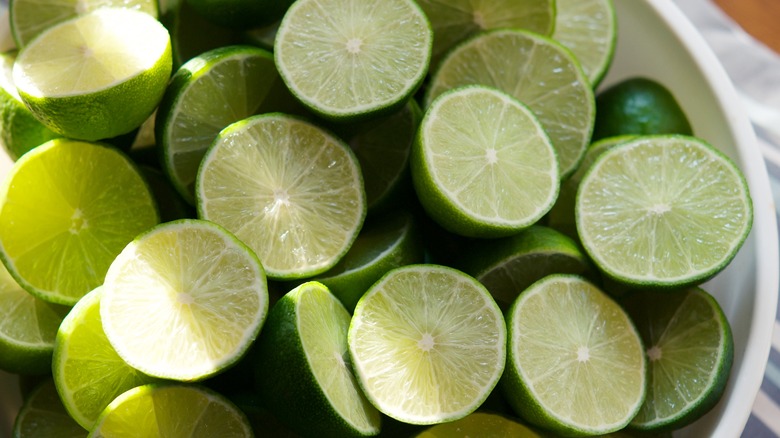 sliced green limes in sunshine