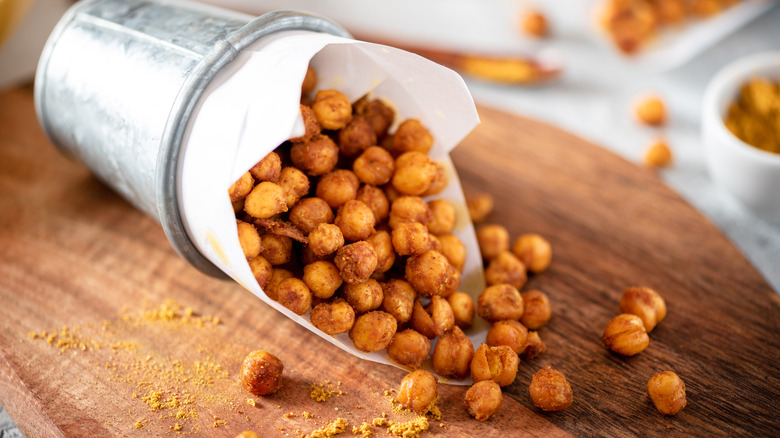 Roasted spiced chickpeas on wooden board