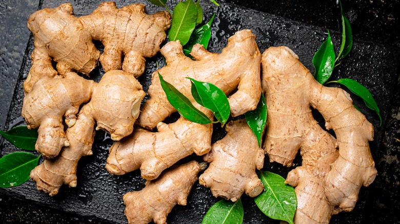 Ginger with leaves on board