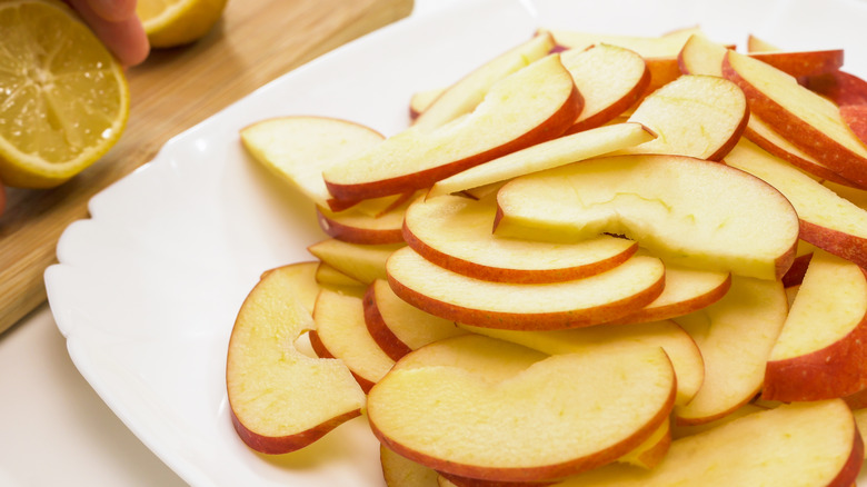 Apple slices on white plate