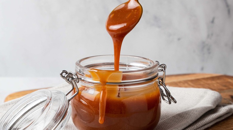 Homemade caramel sauce in a jar