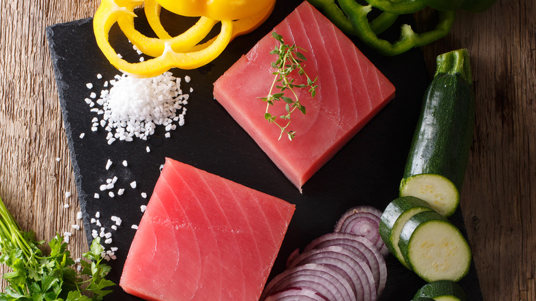 raw tuna steak and seasonings