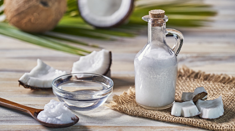 Coconut oil beside coconut chunks