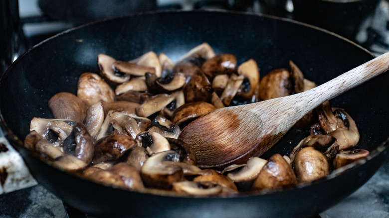 mushrooms cooking in a sauté pan