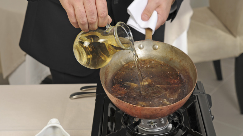 white wine deglazing a pan